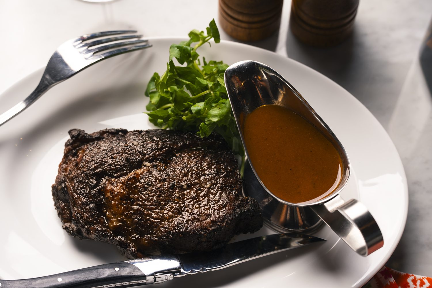 Wood-fired ribeye with peppercorn sauce